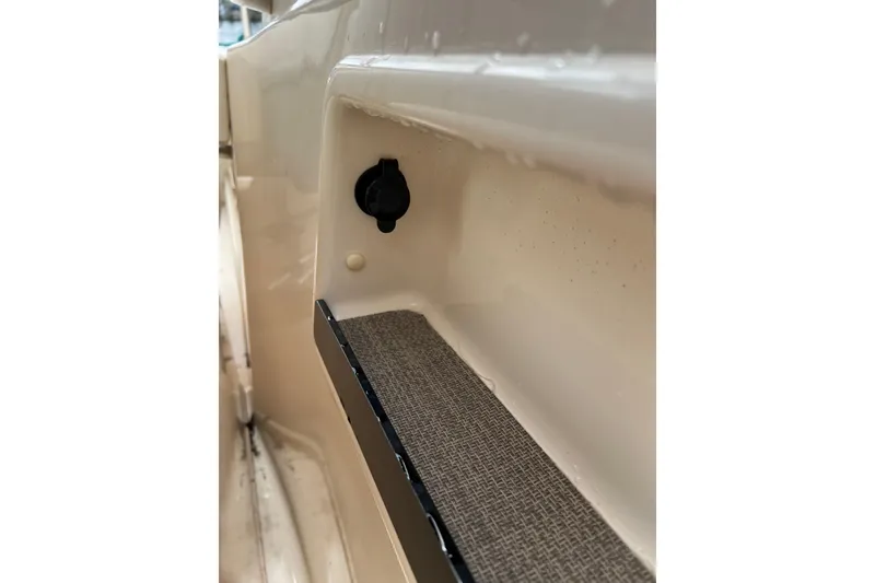 Slide: The Image of 2019 Grady-White Freedom 235 boat interior detail with storage compartment. - 16