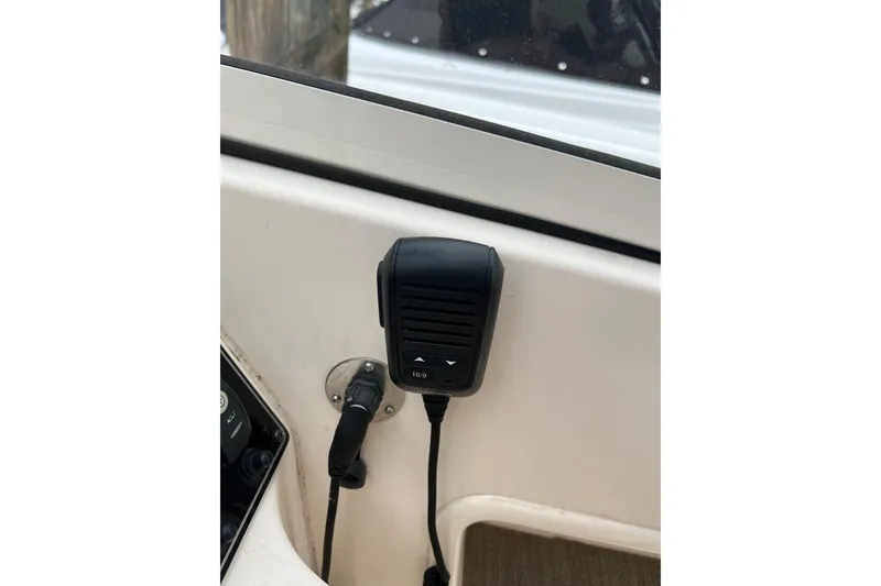 Slide: The Image of Boat communication device on 2019 Grady-White Freedom 235 dashboard. - 21