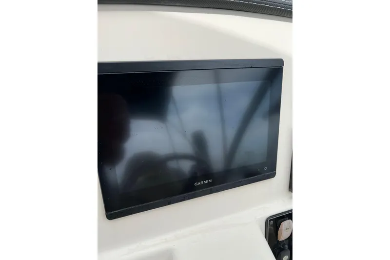 Slide: The Image of Garmin display on 2019 Grady-White Freedom 235 boat dashboard. - 24