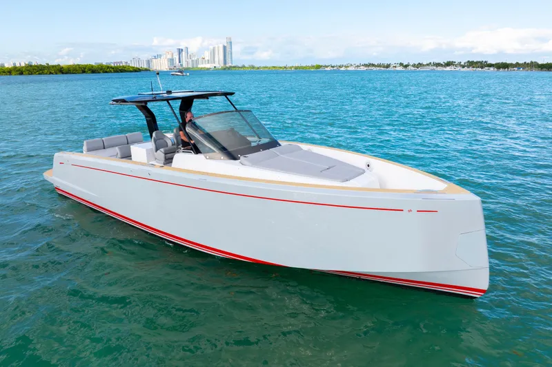 Slide: The Image of 2021 Pardo Yachts 38 cruising on blue water with city skyline in background. - 12