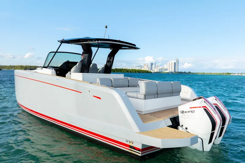 Slide: The Image of 2021 Pardo Yachts 38 cruising on blue water with city skyline in background. - 13