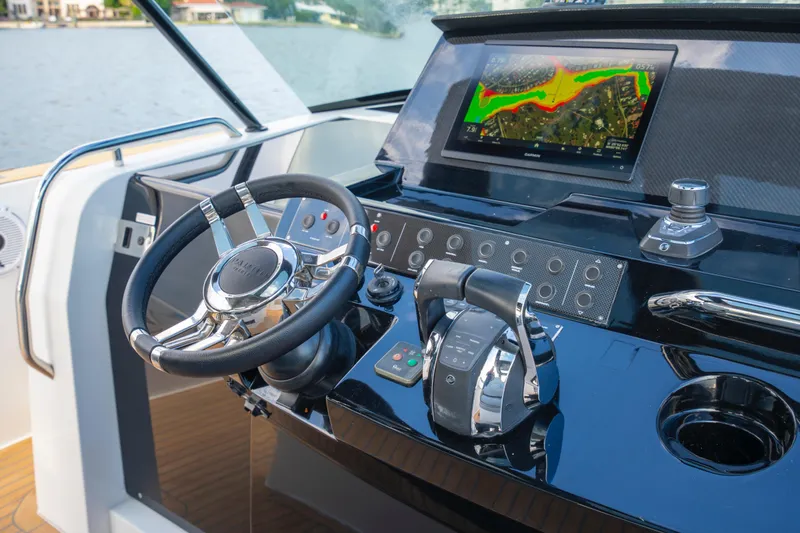 Slide: The Image of Helm of 2021 Pardo Yachts 38 with navigation display and controls. - 27