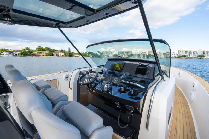 Slide: The Image of Cockpit of 2021 Pardo Yachts 38 with modern controls and waterfront view. - 28