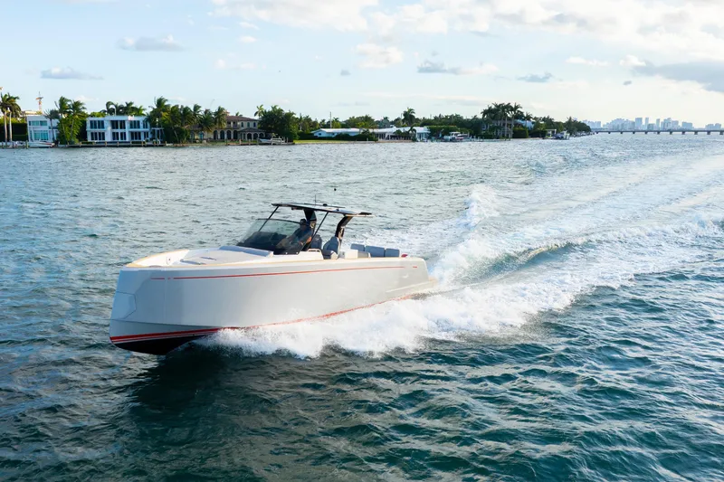 Slide: The Image of 2021 Pardo Yachts 38 cruising on a sunny day near waterfront homes. - 3