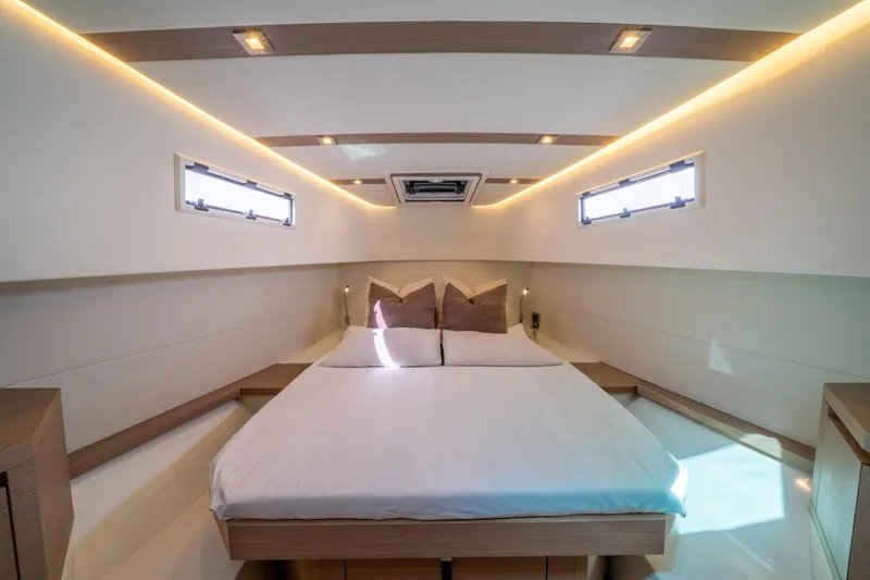 Slide: The Image of Luxurious cabin interior of 2021 Pardo Yachts 38, featuring a cozy bed and modern lighting. - 49