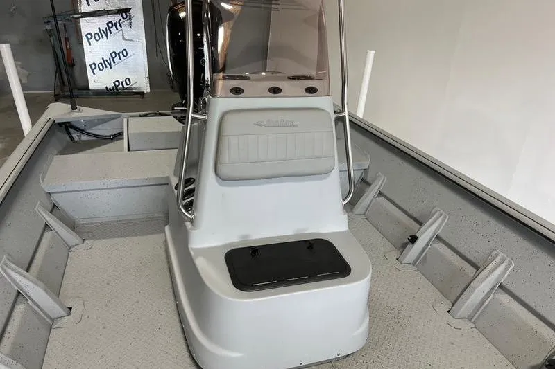 Slide: The Image of 2024 SeaArk 2272 MVT boat interior with console and seating. - 3