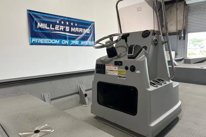 Slide: The Image of 2024 SeaArk 2272 MVT boat console at Miller's Marine showroom. - 5