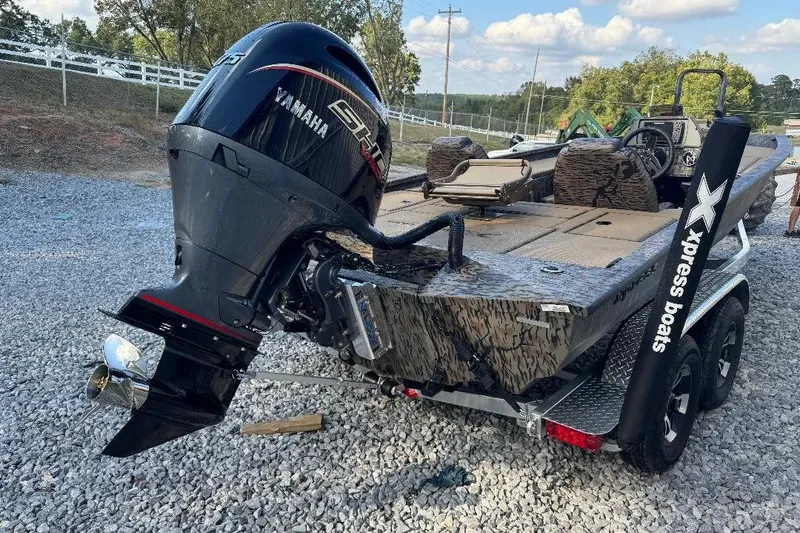 Slide: The Image of 2026 Xpress H20C Crappie boat with Yamaha engine on gravel surface. - 4