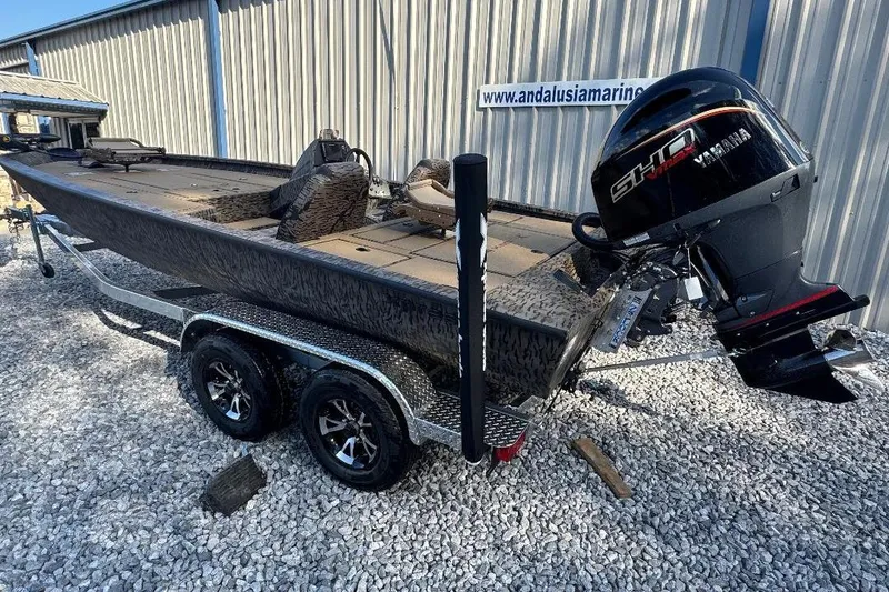 Slide: The Image of 2026 Xpress H20C Crappie boat with Yamaha engine on a trailer, parked on gravel. - 5