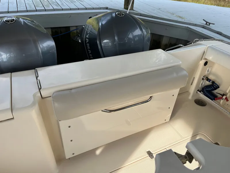 Slide: The Image of 2010 Pursuit OS 345 Offshore boat with Yamaha engines and cushioned seating. - 10