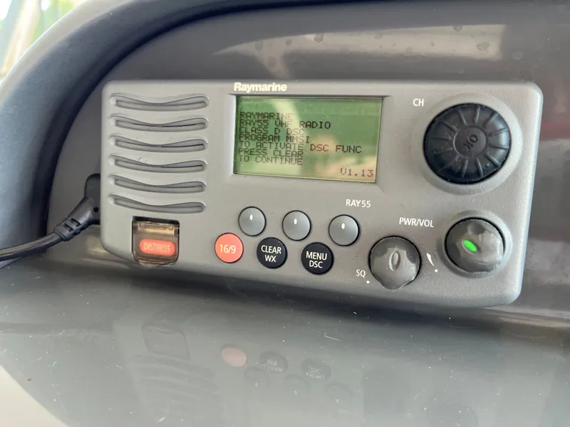 Slide: The Image of Raymarine RAY55 VHF radio on 2010 Pursuit OS 345 Offshore boat dashboard. - 24