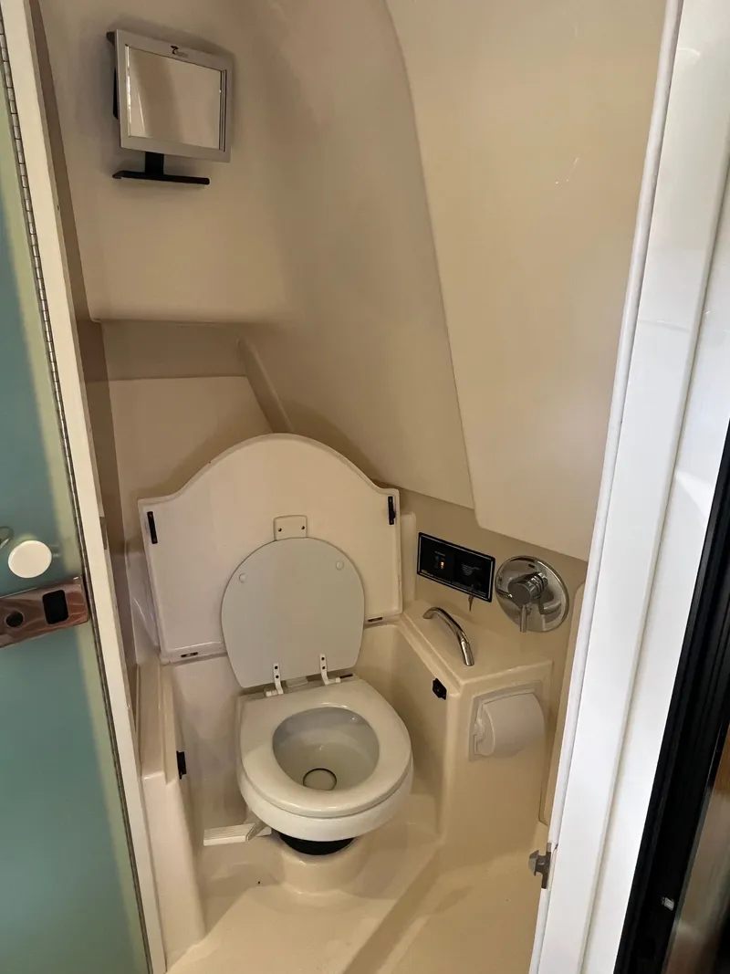 Slide: The Image of Compact marine bathroom in 2010 Pursuit OS 345 Offshore boat. - 26