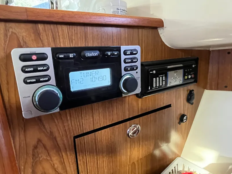 Slide: The Image of Clarion audio system in 2010 Pursuit OS 345 Offshore boat interior. - 31