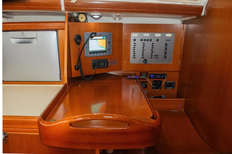 Slide: The Image of Navigation station of 2007 Beneteau Oceanis 523 yacht with control panel and equipment. - 16