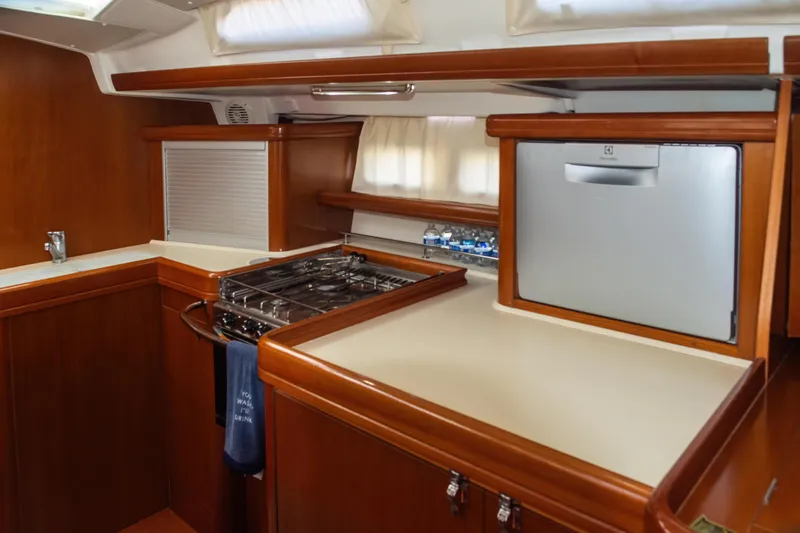 Slide: The Image of Luxurious kitchen in 2007 Beneteau Oceanis 523 yacht with stove and fridge. - 20