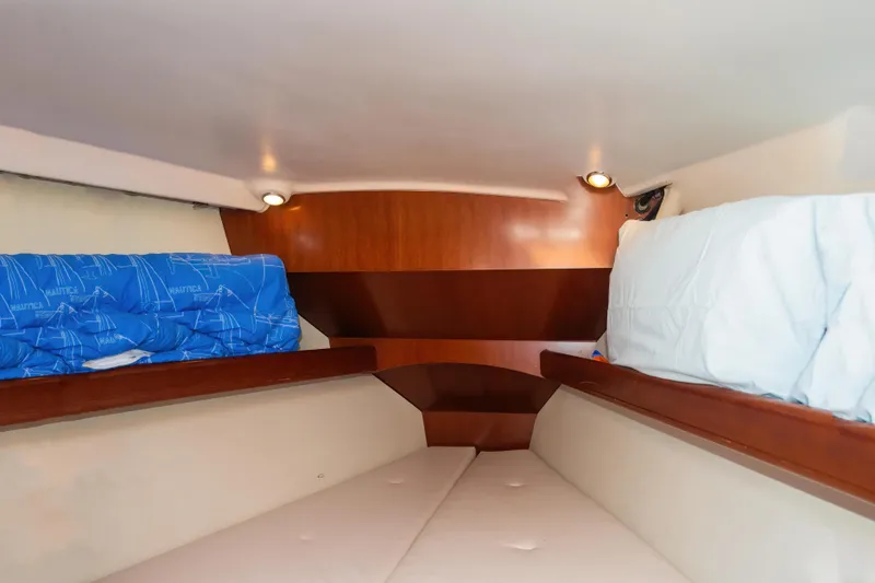 Slide: The Image of Cozy cabin interior of 2007 Beneteau Oceanis 523 yacht with wooden accents and bedding. - 21