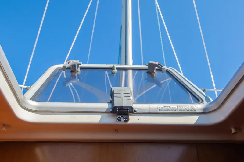 Slide: The Image of Hatch view from 2007 Beneteau Oceanis 523 sailboat, showcasing mast and clear blue sky. - 23