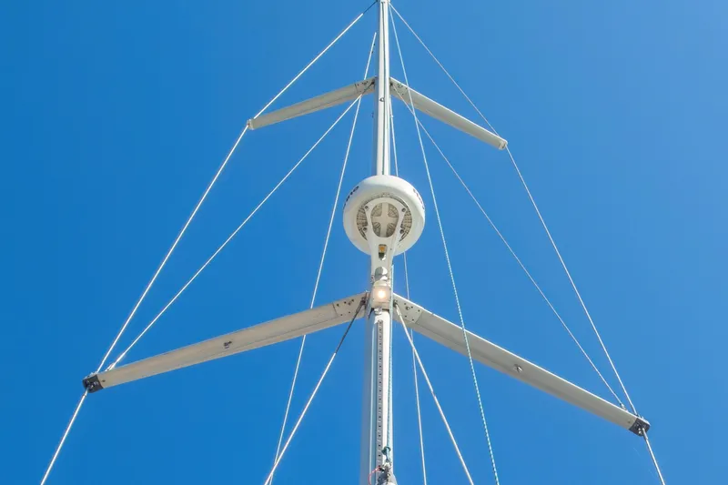 Slide: The Image of Mast of 2007 Beneteau Oceanis 523 sailboat against clear blue sky. - 24