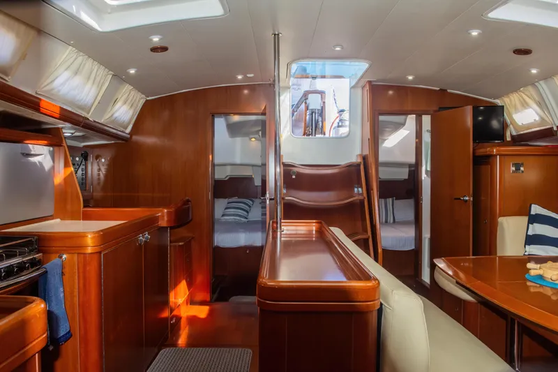 Slide: The Image of Luxurious interior of 2007 Beneteau Oceanis 523 yacht with wood finish and cozy seating. - 9