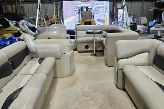 Slide: The Image of Interior of a 2013 Sweetwater SW 2286 pontoon boat with beige seating. - 2