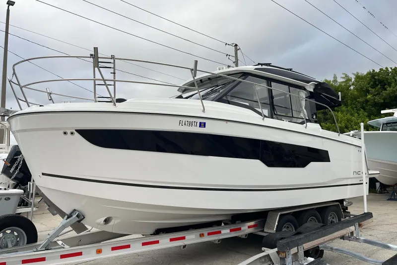 Slide: The Image of 2025 Jeanneau NC 895 Sport Series 2 boat on trailer, side view. - 0