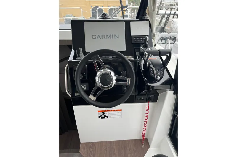 Slide: The Image of 2025 Jeanneau NC 895 Sport Series 2 helm with Garmin navigation system. - 11