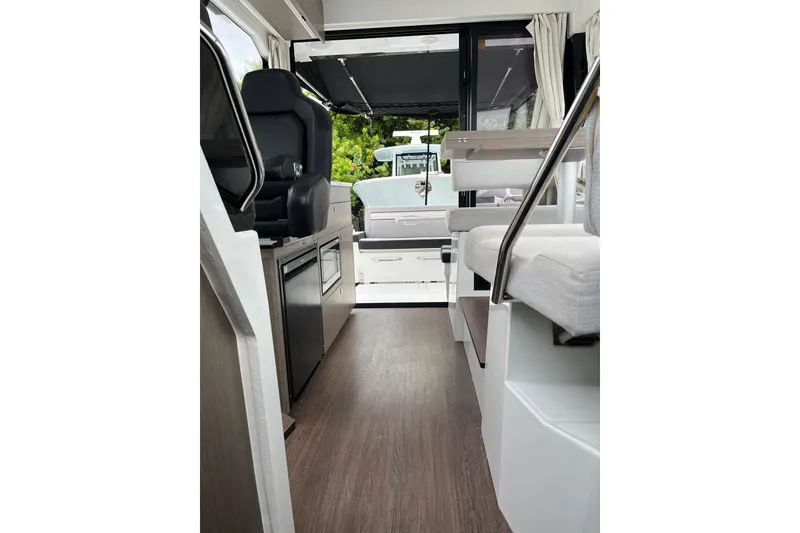 Slide: The Image of Interior of 2025 Jeanneau NC 895 Sport Series 2, featuring modern seating and sleek design. - 28