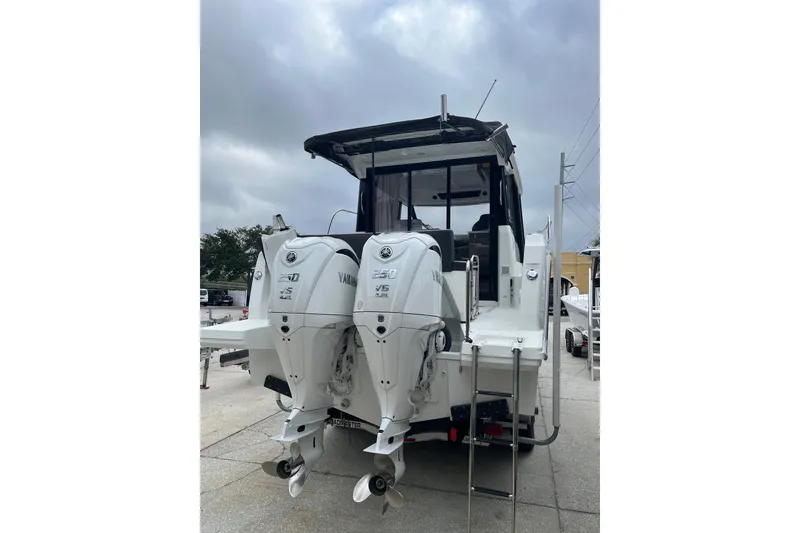 Slide: The Image of 2025 Jeanneau NC 895 Sport Series 2 with dual Yamaha outboard engines. - 3