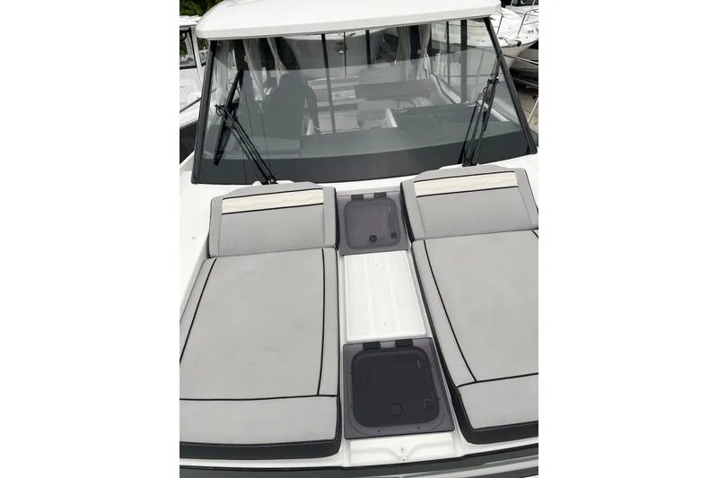 Slide: The Image of 2025 Jeanneau NC 895 Sport Series 2 boat with cushioned deck seating. - 4
