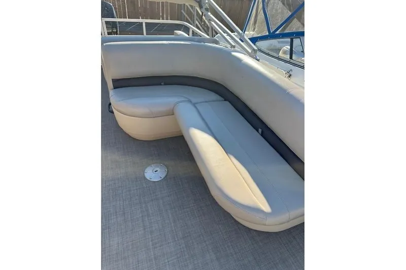 Slide: The Image of 2017 Sun Tracker Party Barge 22 DLX interior seating with gray upholstery. - 12