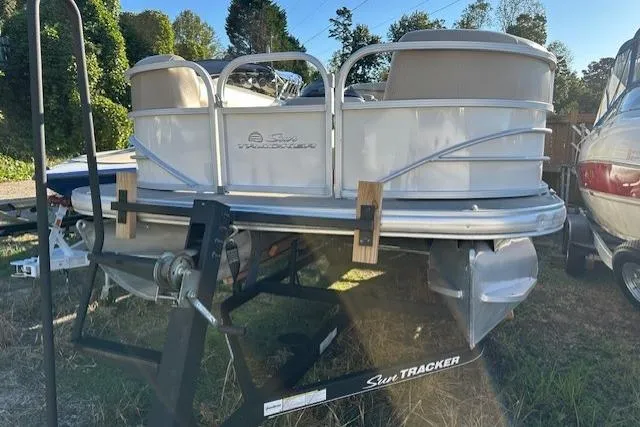 Slide: The Image of 2017 Sun Tracker Party Barge 22 DLX pontoon boat on trailer, parked outdoors. - 3