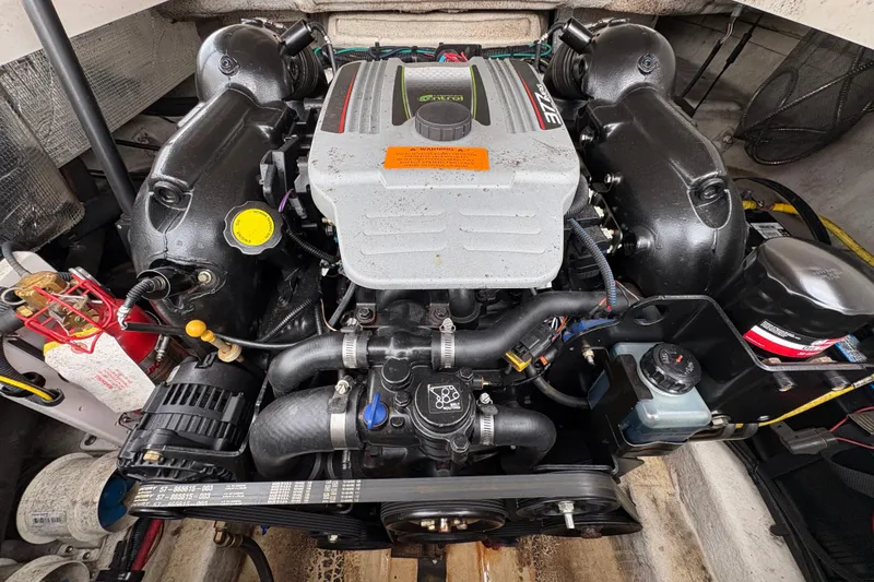 Slide: The Image of Engine of a 2015 Chaparral 264 Sunesta boat, showcasing detailed components. - 12