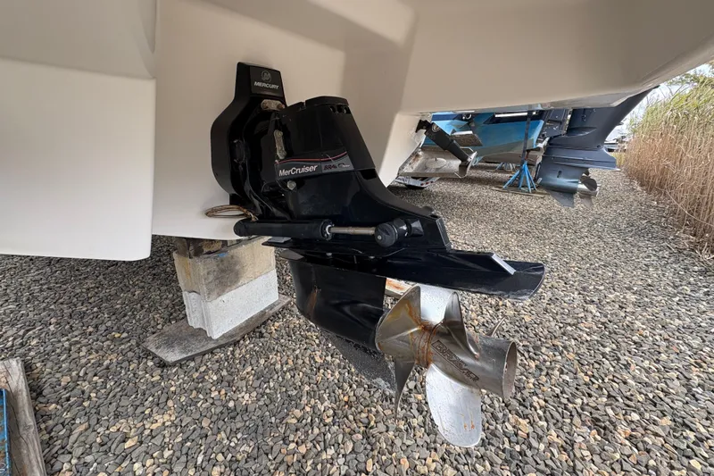 Slide: The Image of 2015 Chaparral 264 Sunesta boat with MerCruiser outdrive on gravel. - 14