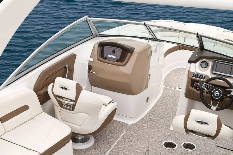 Slide: The Image of 2015 Chaparral 264 Sunesta boat interior with steering wheel and captain's chair. - 7