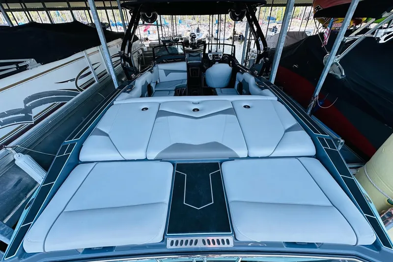 Slide: The Image of 2021 Supreme ZS232 boat interior with sleek white seating and modern design. - 11