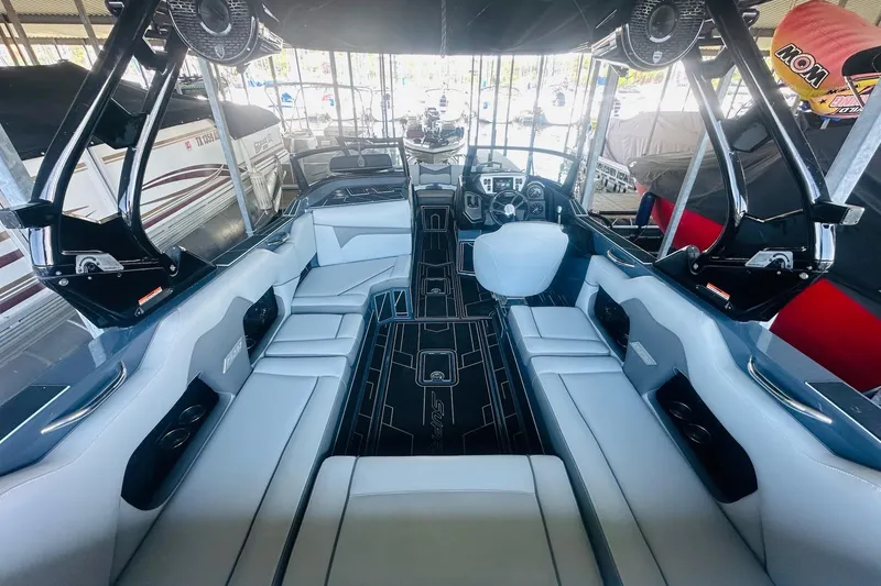 Slide: The Image of 2021 Supreme ZS232 boat interior with sleek seating and modern dashboard design. - 12