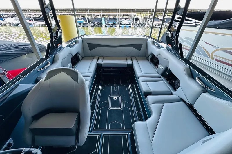 Slide: The Image of 2021 Supreme ZS232 boat interior with sleek gray seating and modern design. - 14