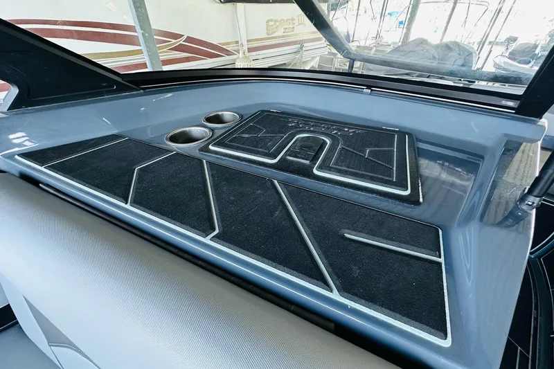 Slide: The Image of 2021 Supreme ZS232 boat dashboard with cup holders and sleek design. - 19