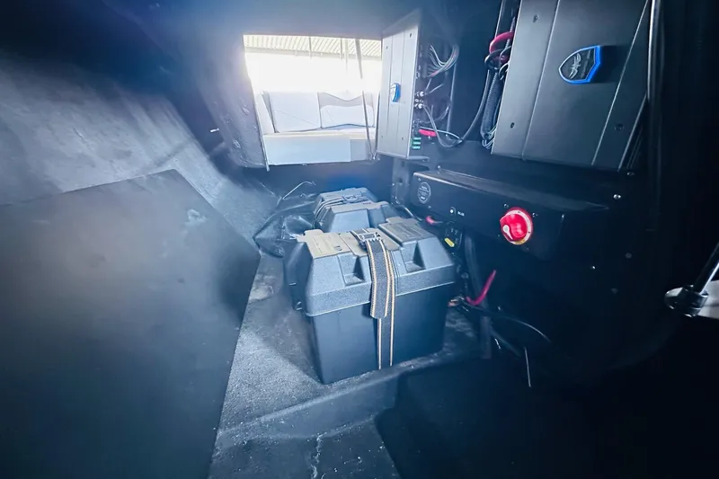 Slide: The Image of Interior view of 2021 Supreme ZS232 boat showing battery compartment and wiring. - 21