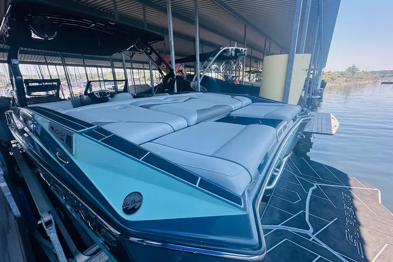 Slide: The Image of 2021 Supreme ZS232 boat docked, featuring sleek design and spacious seating. - 9