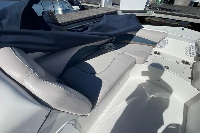 Slide: The Image of 2017 Hurricane SunDeck Sport 202 OB boat interior with cushioned seating and speakers. - 11