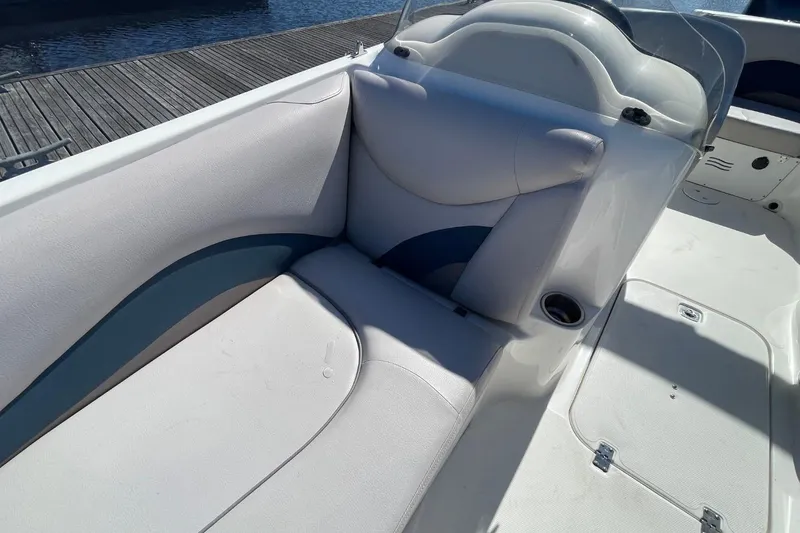 Slide: The Image of 2017 Hurricane SunDeck Sport 202 OB boat interior with cushioned seating and cup holder. - 13