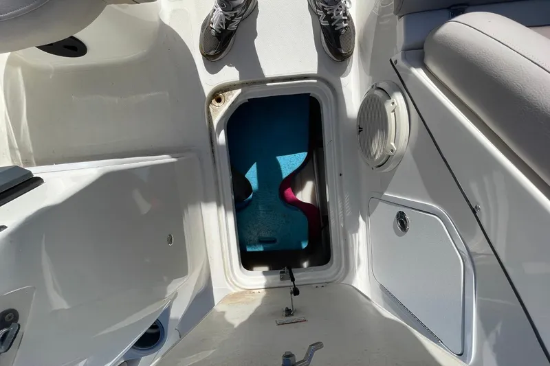Slide: The Image of 2017 Hurricane SunDeck Sport 202 OB boat interior with open storage compartment. - 15