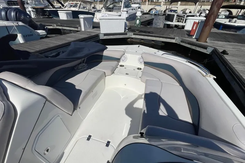 Slide: The Image of 2017 Hurricane SunDeck Sport 202 OB boat interior with seating, docked at marina. - 19