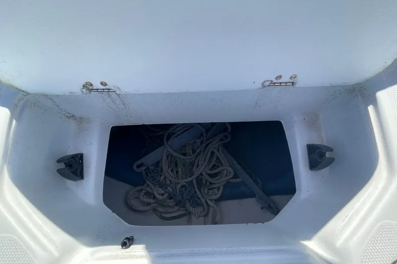 Slide: The Image of Open storage compartment with ropes on a 2017 Hurricane SunDeck Sport 202 OB boat. - 26