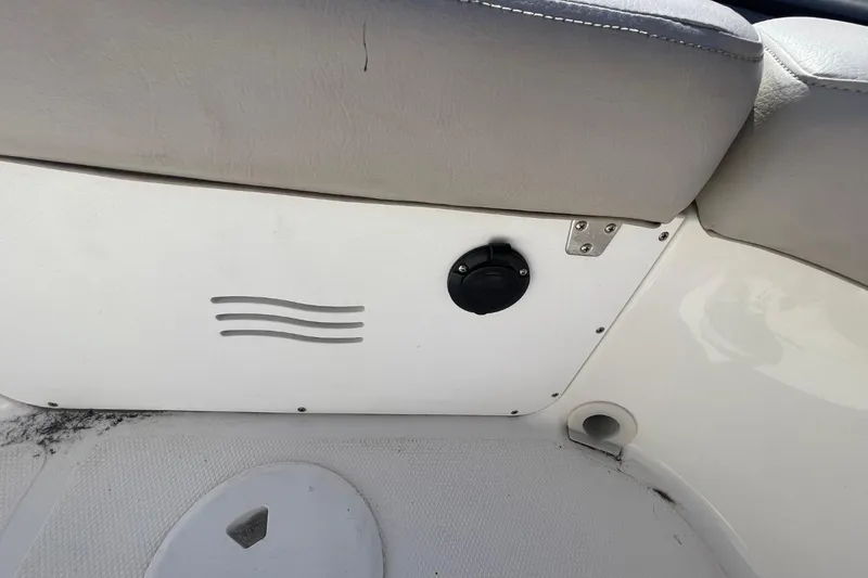 Slide: The Image of Interior detail of 2017 Hurricane SunDeck Sport 202 OB boat, featuring seating and storage compartment. - 28