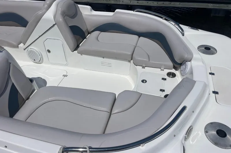 Slide: The Image of 2017 Hurricane SunDeck Sport 202 OB boat interior with gray seating and storage compartments. - 32