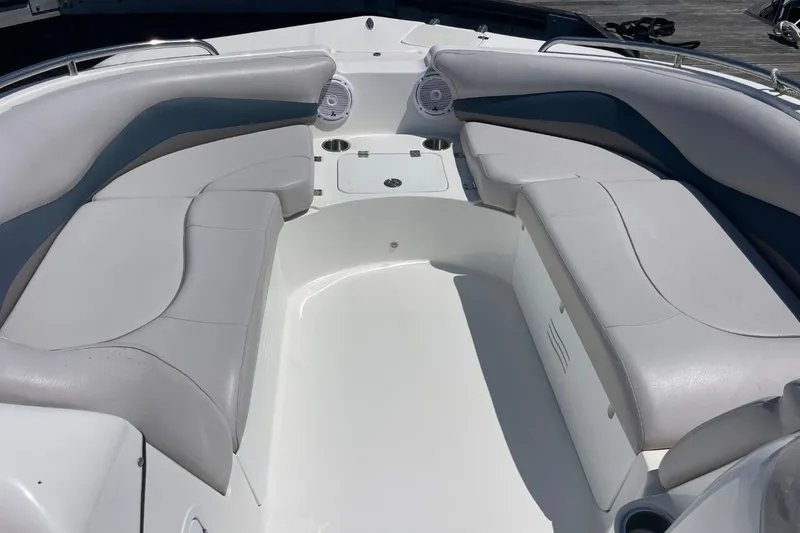 Slide: The Image of 2017 Hurricane SunDeck Sport 202 OB boat interior with cushioned seating and speakers. - 34