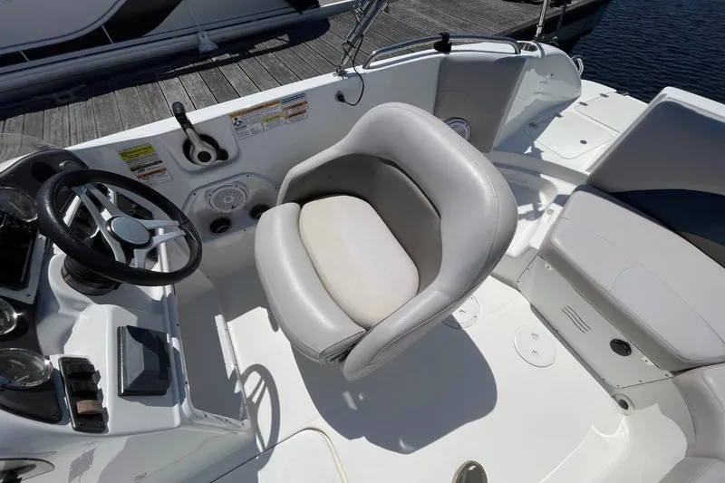 Slide: The Image of 2017 Hurricane SunDeck Sport 202 OB boat interior with steering wheel and seating. - 37