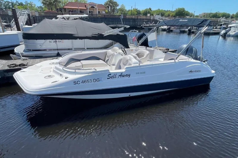 Slide: The Image of 2017 Hurricane SunDeck Sport 202 OB boat docked in marina. - 38